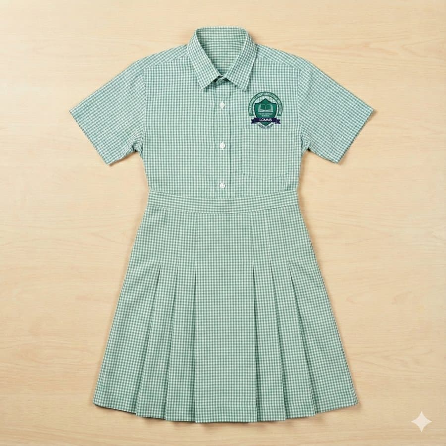 Green checked dress with the school crest