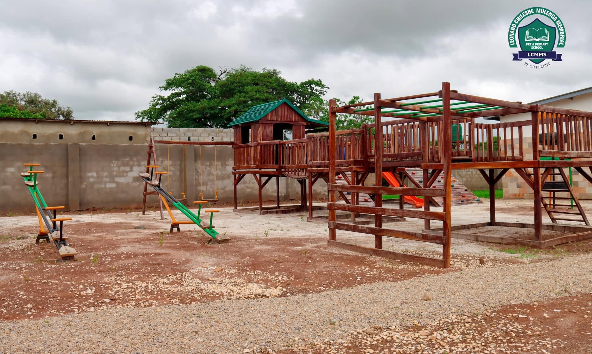 Wooden climbing frames, swings and seesaws in the school playground