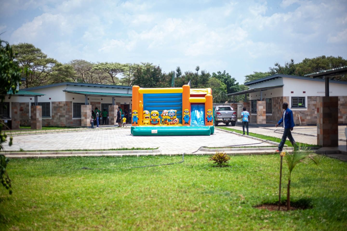 Bouncy castle set up between the school classroom blocks